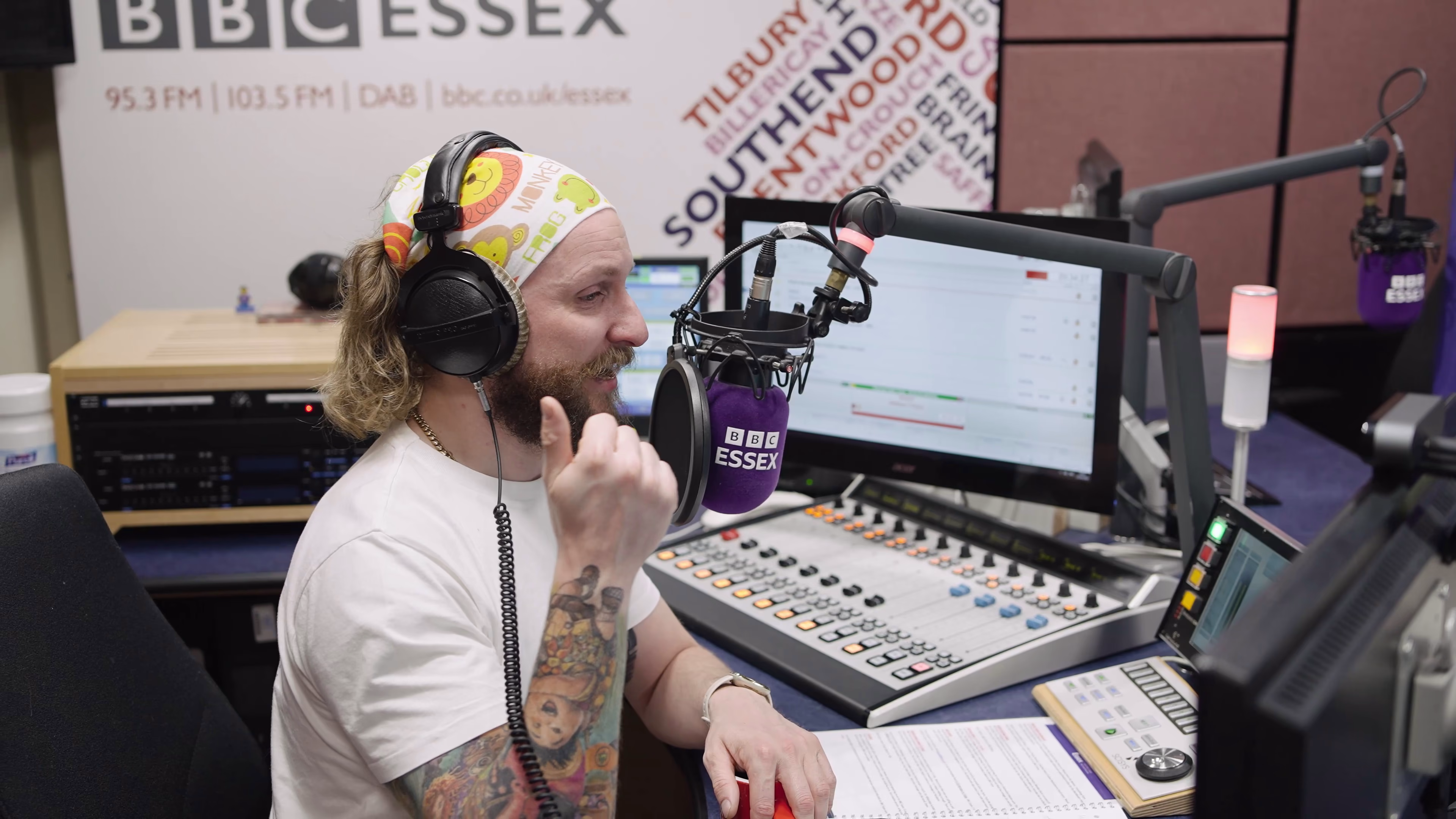Radio presenter at the broadcast console